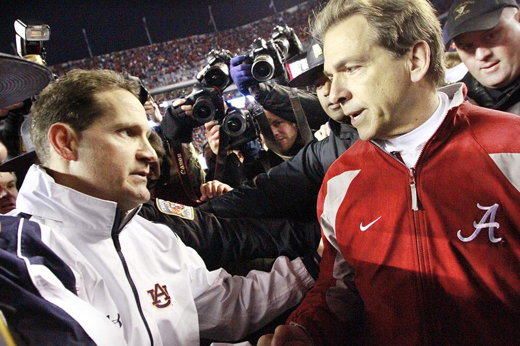 Auburn head coach Gene Chizik, left, and Alabama head coach Nick Saban shake hands following the Auburn's 28-21 win in the Iron Bowl at Bryant-Denny Stadium in Tuscaloosa, Alabama, on Friday, November 26, 2010. Auburn rallied from a 24-0 deficit to remain unbeaten on the season. (Robin Trimarchi/Columbus Ledger-Enquirer/MCT)