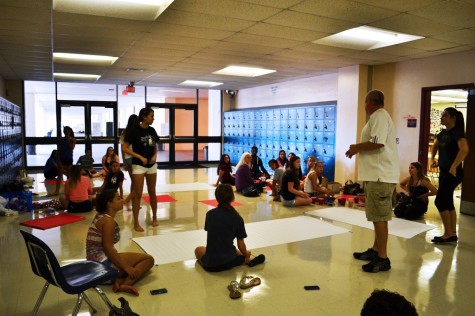 Class President, Kaycee Hair, and class sponsor, Mr. Yohe, instruct the seniors.