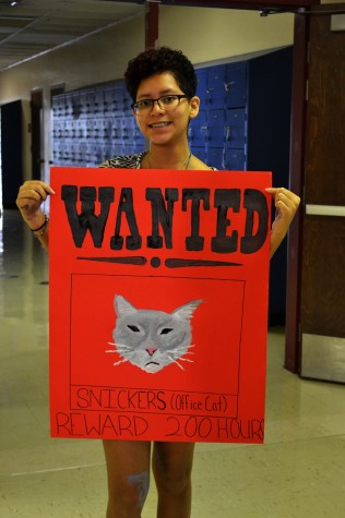 Veronica Dominguez shows off her Snickers WANTED sign.