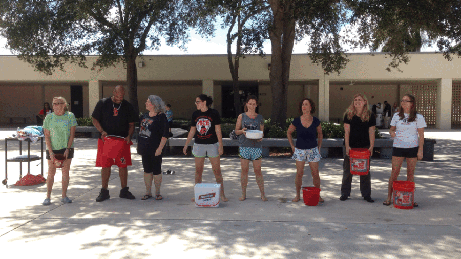 The English Department pours ice water over their heads in honor of the ALS ice bucket challenge. 