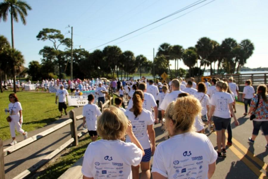 People walk down a trail in support of the Buddy Walk.