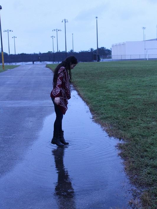 The Tribe Staff Writer, Shuruq Daas, stands in the aftermath of a rainy morning.