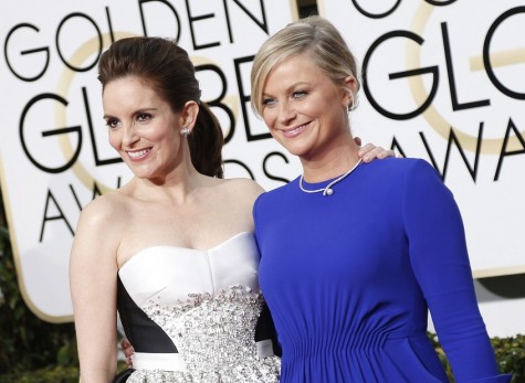 Tina Fey and Amy Poehler arrive at the 72nd Annual Golden Globe Awards show at the Beverly Hilton Hotel in Beverly Hills, Calif., on Sunday, Jan. 11, 2015. (Wally Skalij/Los Angeles Times/TNS)