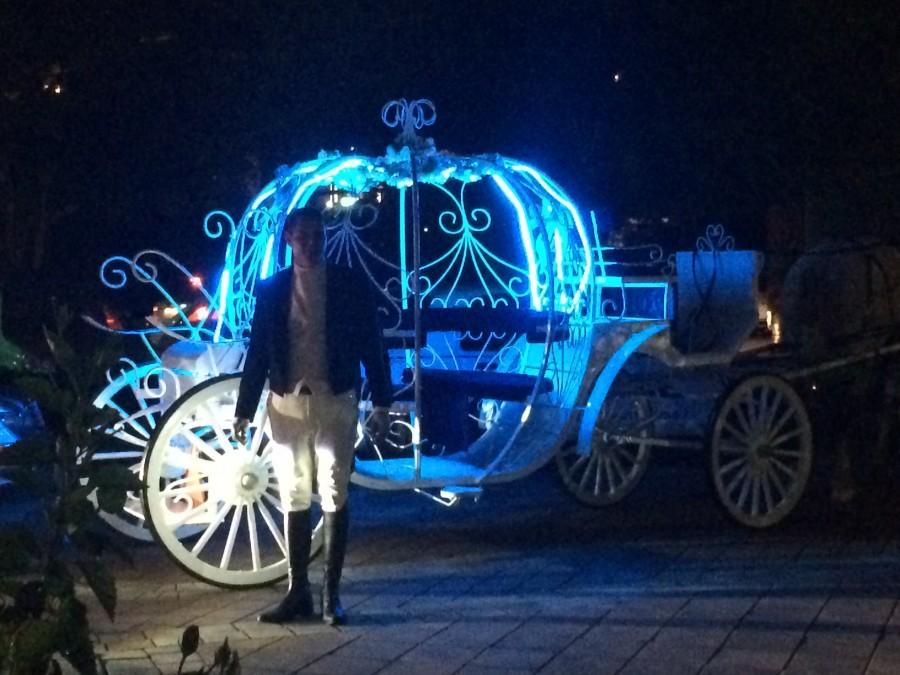 Senior Carean Cola arrives to the Prom in a Cinderella  carriage, complete with horses and footman.