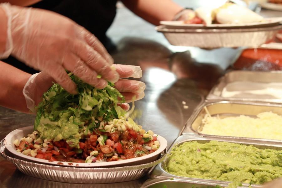 The final touches are added to a Burrito Bowl at a Chipotle restaurant in Chicago, Illinois, on September 28, 2011. The chain is promoting its use of sustainable produce and ethically treated animals. (Michael Tercha/Chicago Tribune/MCT)