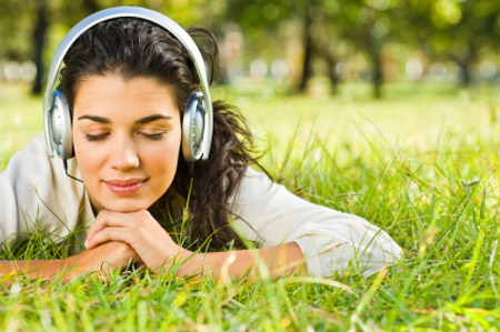 Girl relaxing, listening to music. 