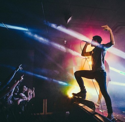 Trenton Woodley of Hands Like Houses on stage.