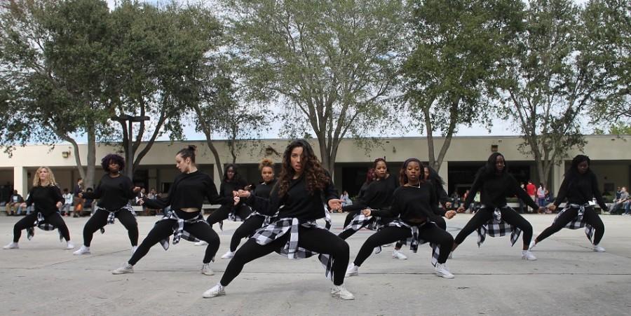 The dance team, Beautiful Chaos, performs in the courtyard to kick off Literary Week, sponsored by the National English Honor Society.