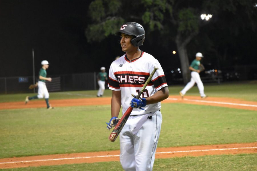 Junior Yash Patel returns to the dugout. 