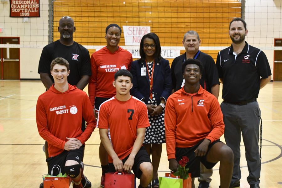 The three seniors, accompanied by Principal Robison and the coaches.