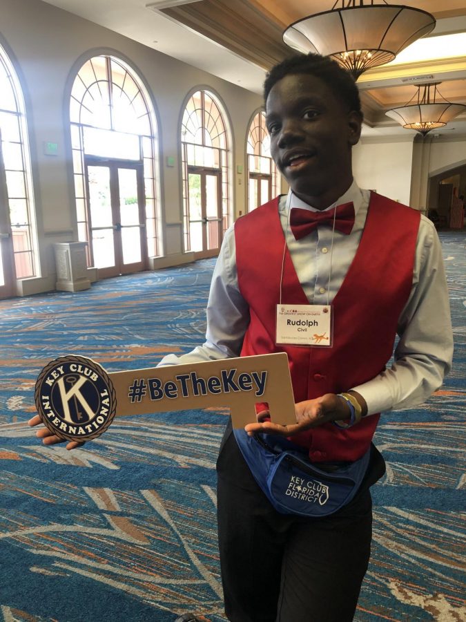 Class Director, Rudolph Civil, holding up the #BeTheKey Key