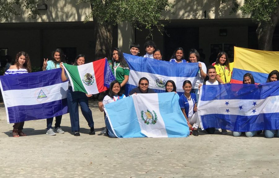 Students show off their country’s flags in a show of pride.