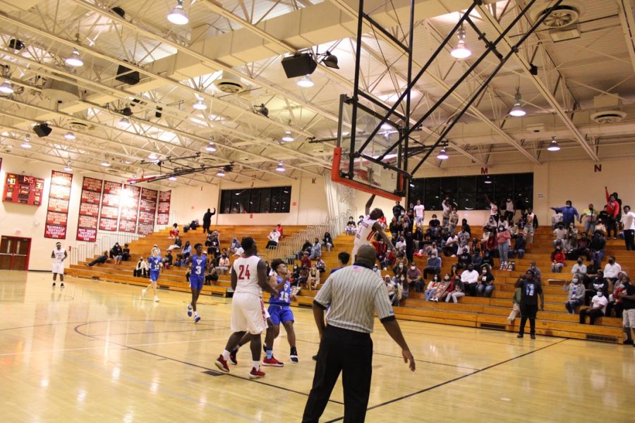 Justin Roseme put on a show as he goes for a dunk. 