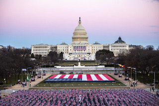 The "Field of Flags" represent those who could not attend the inauguration ceremony due to the COVID-19 pandemic. 