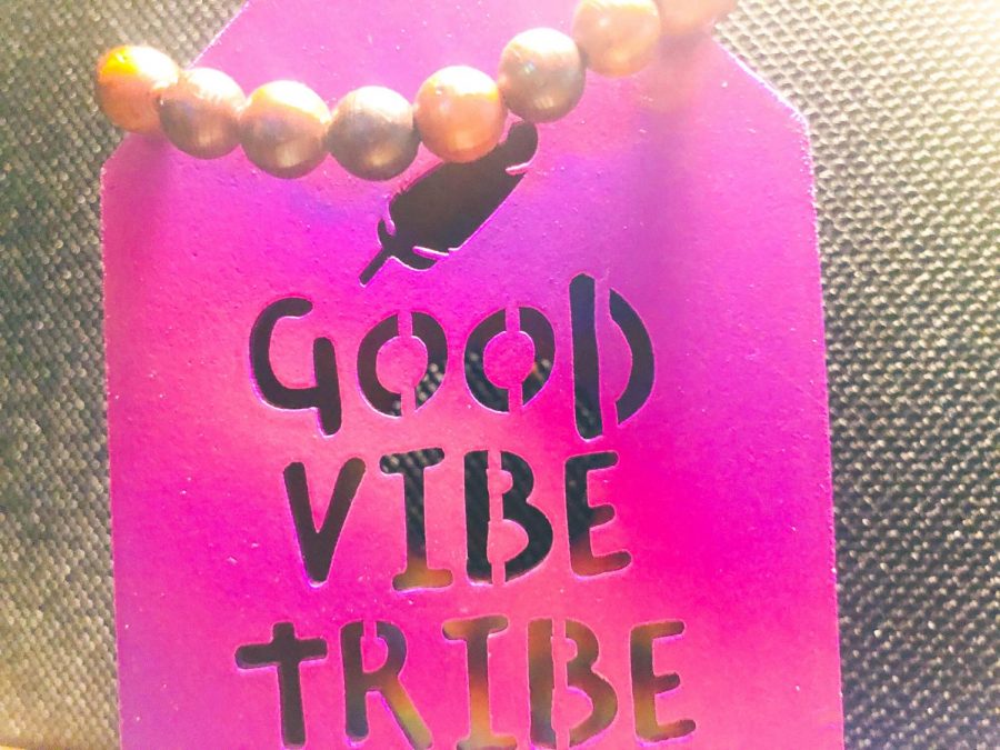 The "Good Vibe Tribe" desk decor alongside my prayer bead bracelet. 