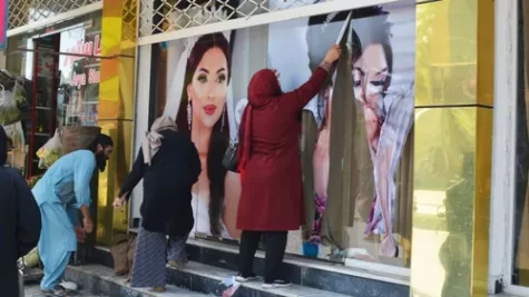 Photos of women in Kabul being covered up because of the impending Taliban rule.