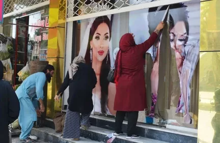 Photos of women in Kabul being covered up because of the impending Taliban rule.