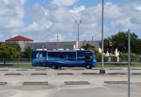 A vaccination bus arrives on campus.