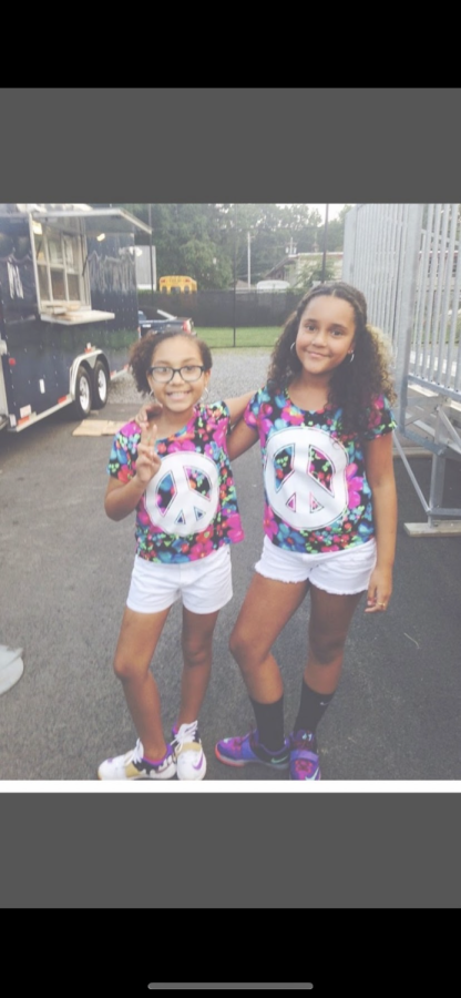 Shayna and her god sister, Amara, at a football game in New York