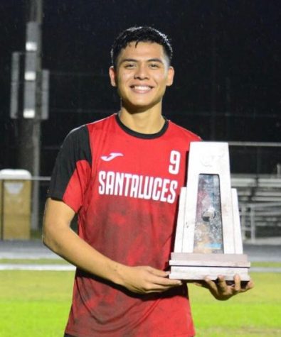 David Perez in his junior year holding the trophy for the District Championship