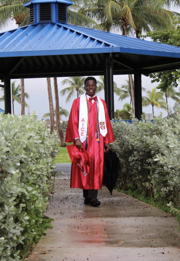 Rudolph Civil Class of 2020 taking pictures with his AICE academic stole at a beach pavilion!