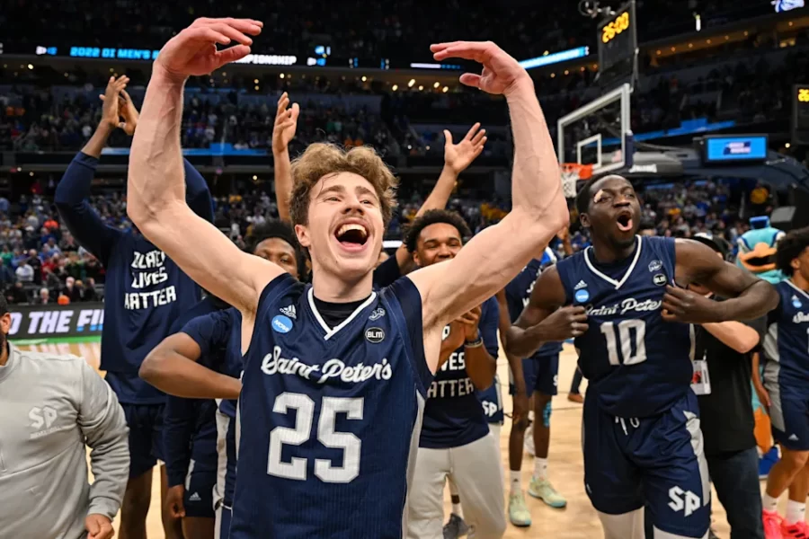 Saint Peters players getting hyped and excited after defeating Kentucky in the March Madness tournament.