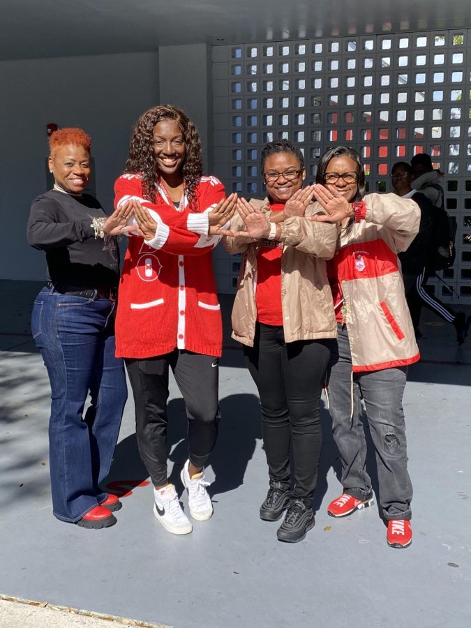 Ms. Holiday, Coach Ross, Ms. Scott, and Principal Robinson all represent the sorority, Delta Sigma Theta that they are participating in when they were in college. 