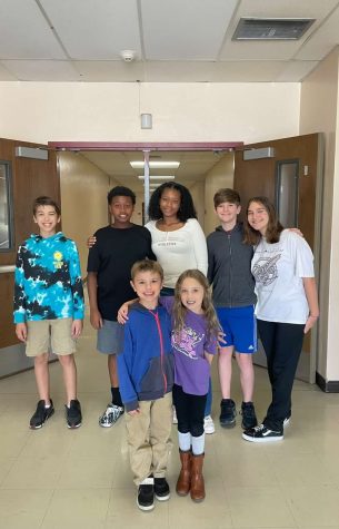 Children of Ms. Harms, Ms. Bower, Mrs. Johnson, and Mr. Dickerson gather around to take a photo after having a fulfilling day on bring you Child to Word Day!