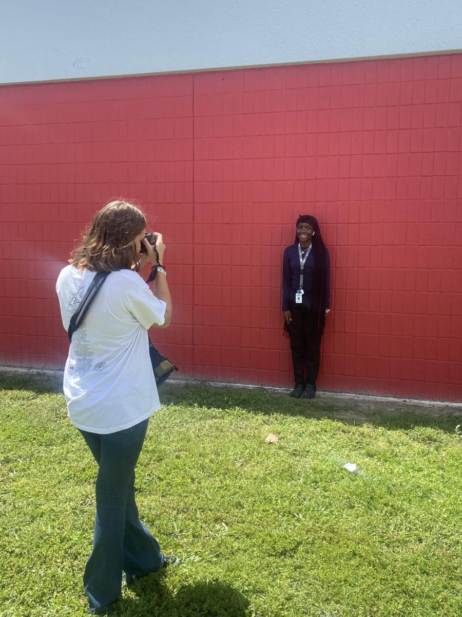 Photographer, Allison Bower, taking photos for the Tribes staff profiles. 