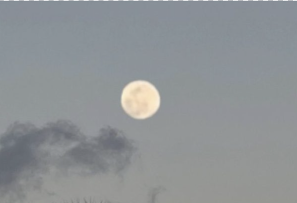The strawberry moon at the beach on June 3rd, 2023