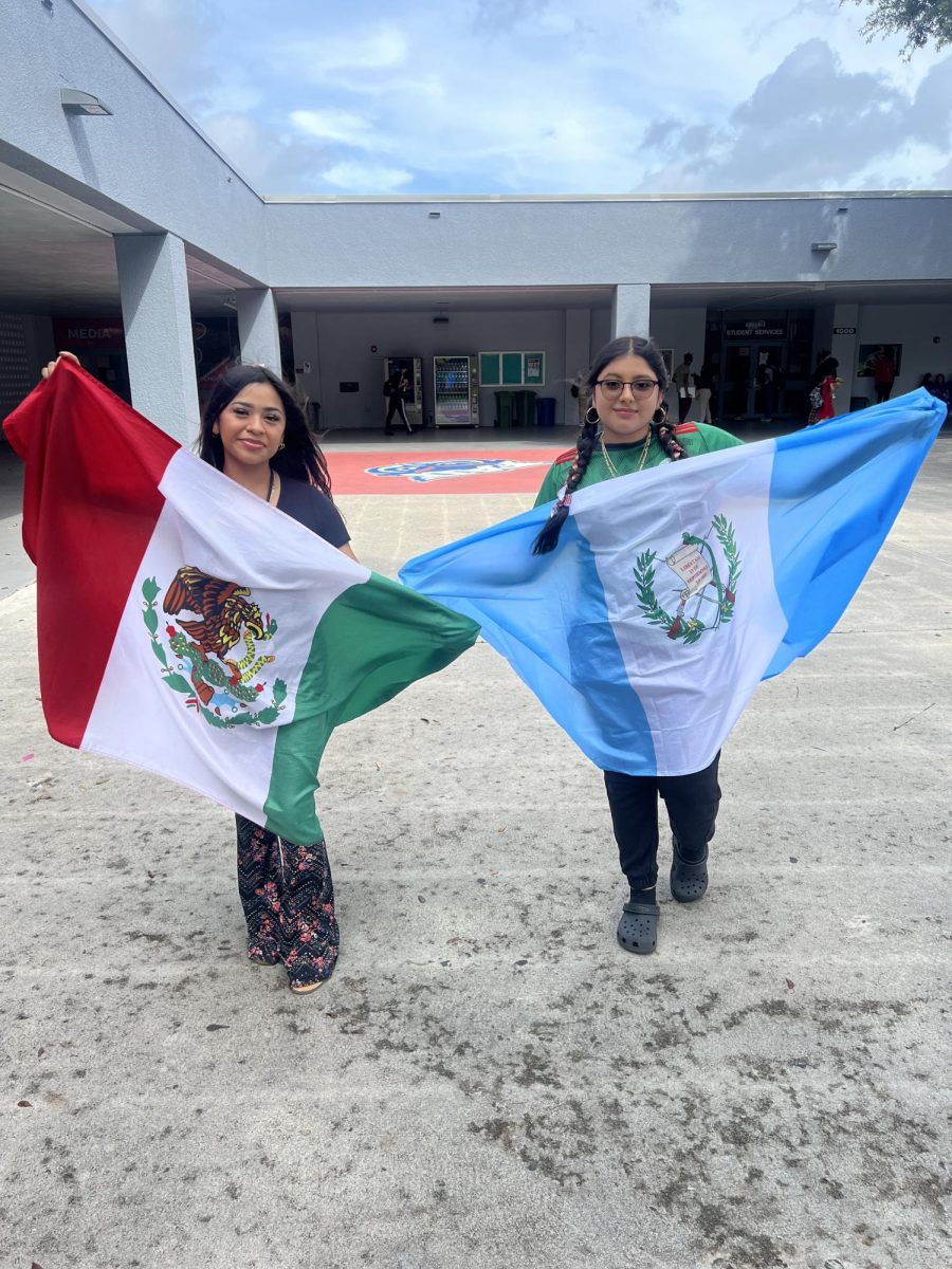 Two girls repping their flags during lunch.