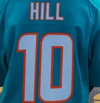 A picture of a Miami Dolphins Tyreek Hill home jersey.