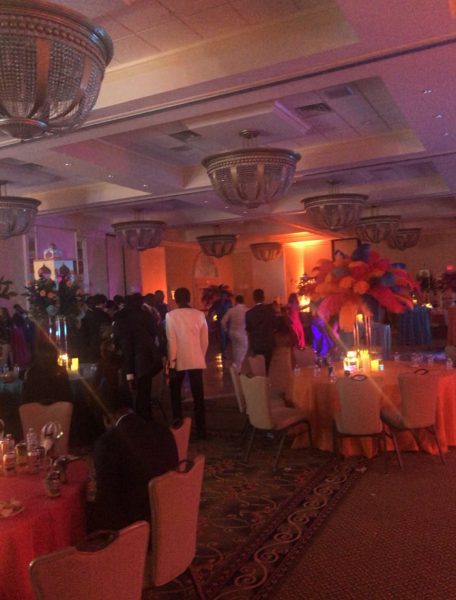 Students dancing on the dance floor and taking in the beauty of the venue and decorations.