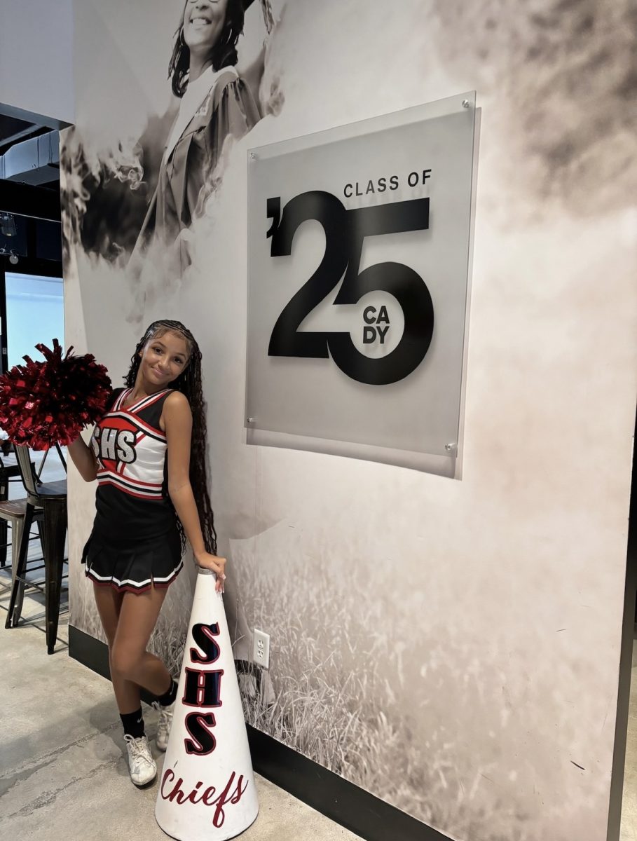 A photo of Jasmine Brooks in her Cheer Uniform.