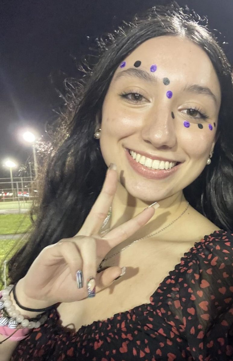 Selfie of Natalie at a football game.