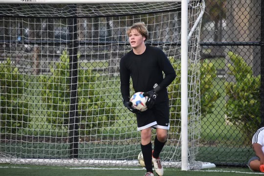 Photo of Shane Rodger on the soccer field.