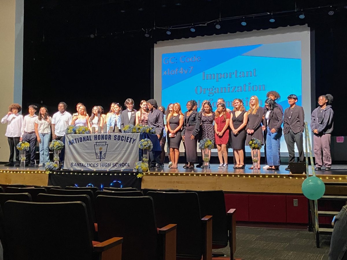 Last year's newly inducted members on stage.