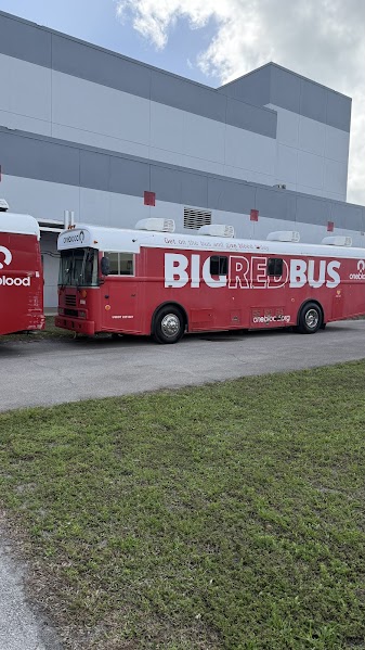 The One Blood buses next to the PAC.
