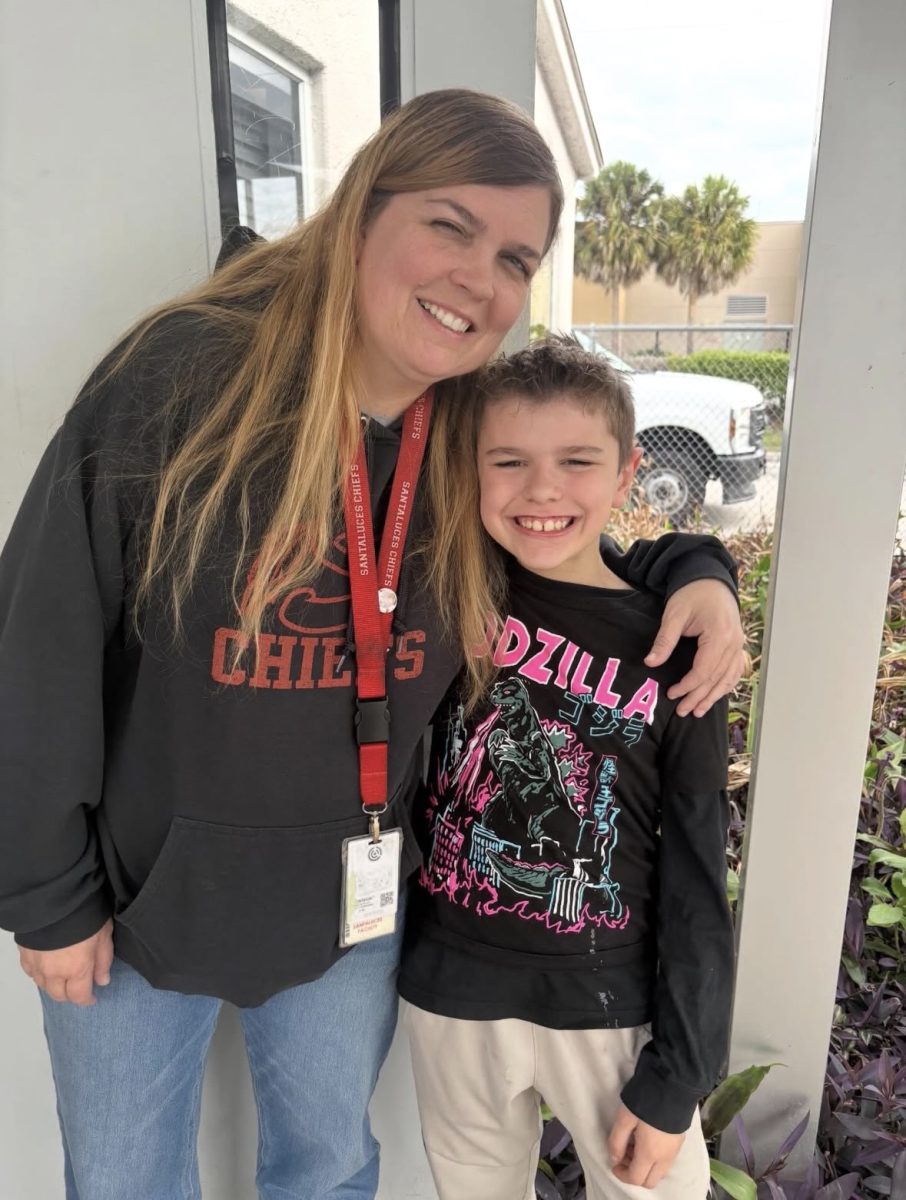 Ms. Harms and her son Ozzie taking a picture together on Take Your Child to Work Day.